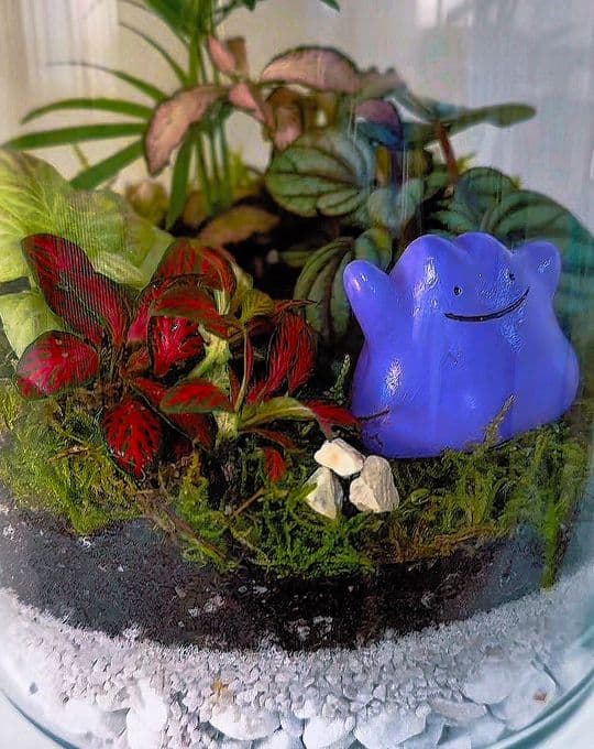 A fan art miniature in a hand-made terrarium