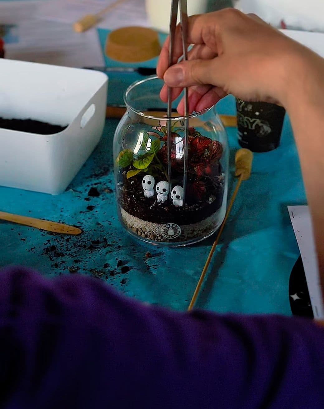A fan art miniature in a hand-made terrarium